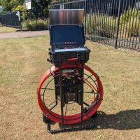 Front view of open Razorback Big Unit 39mm drain camera control box on grass